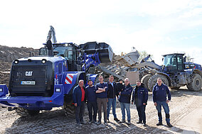 Emissionsarmer Radlader 966XE unterstützt Schlitzwandlager für Bau der U5 in Hamburg 